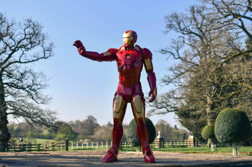 A detailed metal sculpture of Iron Man at the British Ironwork Centre, depicting the iconic superhero in a dynamic pose with intricate details and craftsmanship.