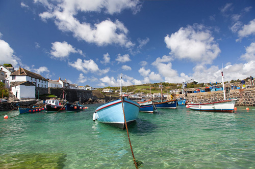 Explore Coverack, a charming village in Cornwall with stunning coastal views, a picturesque harbor, and beautiful beaches perfect for relaxation and exploration