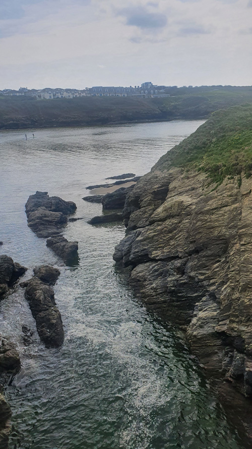 Experience the stunning view of the Newquay coast in Cornwall. Enjoy expansive vistas of rugged cliffs, sandy beaches, and the sparkling Atlantic Ocean, showcasing the dramatic natural beauty of this popular seaside destination.