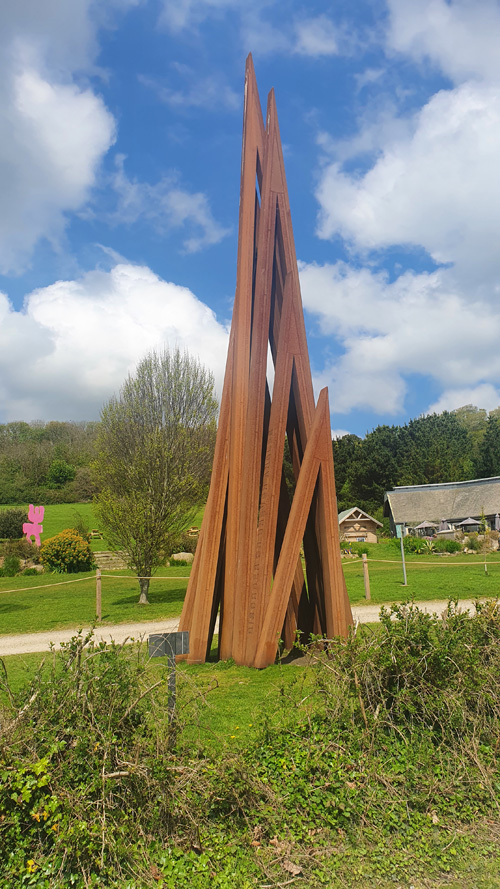 Discover the striking spike sculpture at Tremenheere Sculpture Gardens in Cornwall. Experience this contemporary art piece set against the lush, subtropical backdrop of the gardens.