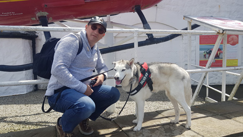 Capture a heartwarming selfie with your dog at Land's End, Cornwall. Enjoy the breathtaking coastal views and iconic Land's End sign while sharing a memorable moment with your furry friend.