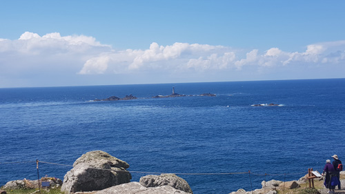 Experience the breathtaking view from Land's End looking out to sea. Enjoy the dramatic cliffs and expansive Atlantic Ocean, capturing the stunning natural beauty at the westernmost point of Cornwall.