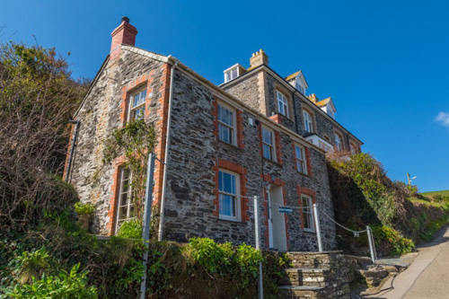 Explore Port Isaac, the charming Cornish village and home of the TV series 'Doc Martin.' Discover the picturesque streets, iconic filming locations, and scenic coastal views that define this beloved destination.