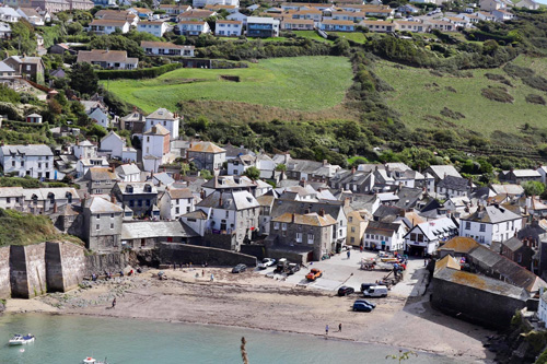 Enjoy stunning views over the harbor in Port Isaac, a charming Cornish village. Experience the picturesque scenery, historic fishing boats, and quaint village life set against the rugged coastline.