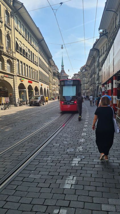 Charming cobblestone street in Bern lined with historic buildings