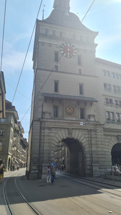 Käfigturm Clock Tower, an iconic building, set against a clear sky with surrounding streets