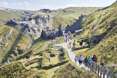 Enjoy spectacular views of the rugged coastline and the Atlantic Ocean as you walk down to Tintagel Castle. Experience the stunning natural beauty and dramatic landscapes that surround this historic site.