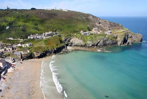 Explore Trevaunance Cove in Cornwall, a picturesque beach with clear waters, rocky outcrops, and a charming coastal village atmosphere, perfect for relaxing and coastal walks