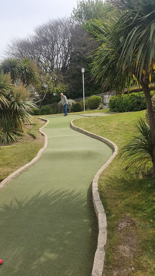 Enjoy a fun-filled game of crazy golf in the park in Newquay, Cornwall. Perfect for families and friends, this vibrant mini-golf course offers engaging challenges and a delightful outdoor experience.