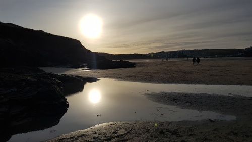 Discover Perranporth Beach in Cornwall, known for its expansive golden sands, clear waters, and vibrant surf scene. Ideal for beach activities, relaxation, and scenic coastal views.