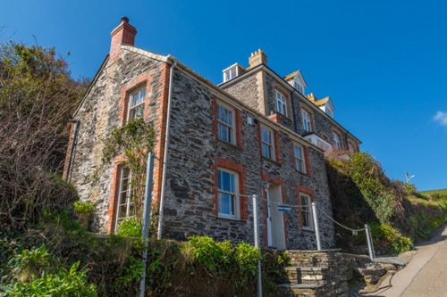 Explore Port Isaac, the charming Cornish village and home of the TV series 'Doc Martin.' Discover the picturesque streets, iconic filming locations, and scenic coastal views that define this beloved destination.