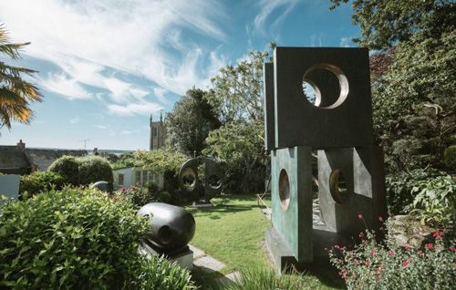 A striking photo of the Barbara Hepworth Museum and Sculpture Garden, capturing the elegant sculptures and serene garden setting. The image showcases the iconic works of Barbara Hepworth, set amidst the lush, tranquil surroundings of the museum’s garden in St Ives, Cornwall. Ideal for art enthusiasts, visitors to the museum, and those interested in modern sculpture