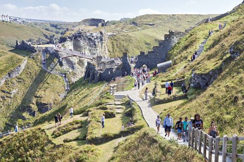 Enjoy spectacular views of the rugged coastline and the Atlantic Ocean as you walk down to Tintagel Castle. Experience the stunning natural beauty and dramatic landscapes that surround this historic site.