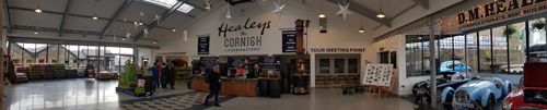 Explore the inviting interior of Healeys Cornish Cyder Farm. Experience the charming atmosphere, including cider production areas, visitor amenities, and engaging displays showcasing the heritage of Cornish cider-making.