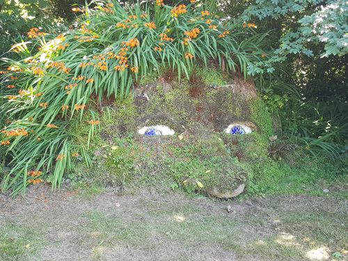 Explore the iconic 'Famous Head' at The Lost Gardens of Heligan. Marvel at this striking and historic sculpture nestled within the garden's lush landscape, adding a unique and memorable element to your visit